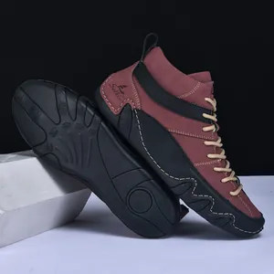 Detail view of durable high-top men's boots showing anti-slip rubber soles and leather texture