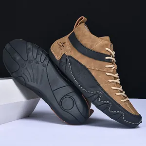 Detailed side view and rubber grip sole of brown matte leather high-top casual boots