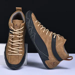 Detailed view of Salkin high-top outdoor boots with tan nubuck leather and sturdy laces