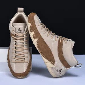 Detailed close-up of Salkin high-top casual sneakers with contrast stitching and woven laces