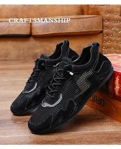 Detail of black breathable mesh casual shoes with gold dotted pattern on vintage leather sofa