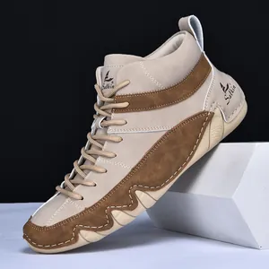 Men's high-top khaki hiking boots with rugged stitching and non-slip wavy sole