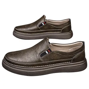 Men's dark brown slip-on leather shoes with tricolor stripe detail and thick rubber sole