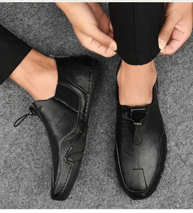 Detail view of black leather casual shoes with elastic drawstring lace-up and non-slip sole