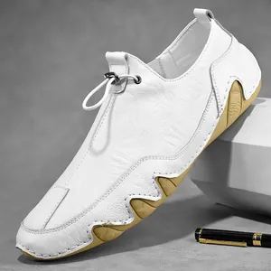 White leather casual shoes for men featuring elastic drawstrings and khaki rubber soles