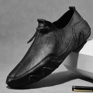 Men's premium black leather loafers with drawstring detail on a geometric stand