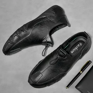 Black genuine leather slip-on loafers for men with a soft sole and drawstring detail