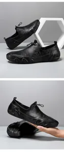 Detail of genuine leather texture and wavy non-slip sole on black men's casual shoes