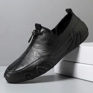 Men's black genuine leather loafers with metal buckle and textured rubber sole