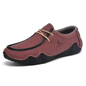 Detailed side view of deep red suede casual men's shoes with decorative yellow laces