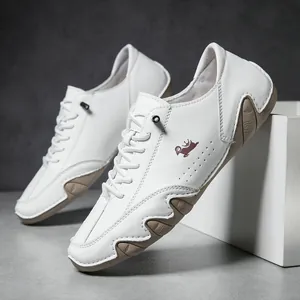 Detailed view of white leather low-top sneaker with crown logo and wavy rubber sole