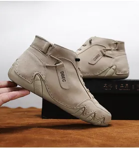Detailed side view of high-top leather sneakers featuring DBEC strap and wavy sole