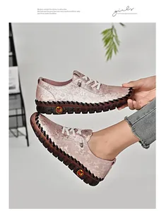 Detailed macro view of pink floral pattern and thick rubber sole on women's casual shoes
