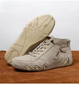 Detail of high-top leather sneakers featuring wavy non-slip rubber soles and DBEC side labels