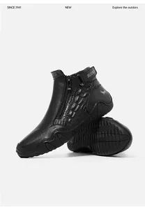 Detail of warm leather boots featuring crocodile pattern and non-slip rubber soles