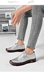 Detail of silver embossed floral casual flats with thick stitching and rubber sole