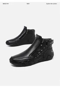 Detail of leather high-top boots featuring side zipper, velcro strap and non-slip sole