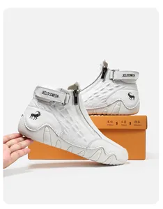 Detail of white crocodile pattern leather boots with side zipper and wave-shaped sole