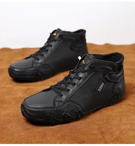 Detail of high-top black leather sneakers with litchi texture and DBEC label branding