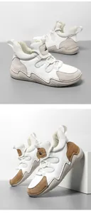 Détails de baskets montantes en cuir avec semelles épaisses et empiècements en daim