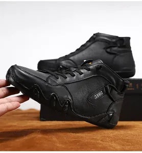 Detail of premium black leather casual boots with unique wavy sole and lace-up design