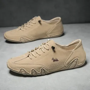 Detail of khaki suede casual shoes featuring crown sheep embroidery and non-slip sole