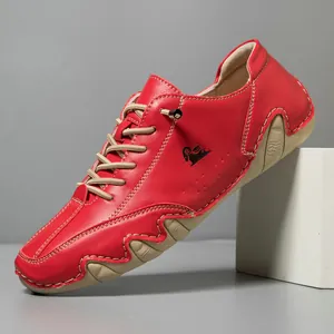 Detailed macro view of red lychee grain leather casual shoe with non-slip rubber sole