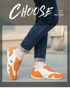 Detail shot of orange and cream patchwork sneakers with thick wavy rubber soles