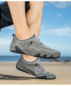 Detail of grey breathable mesh and suede upper on men outdoor casual beach shoes