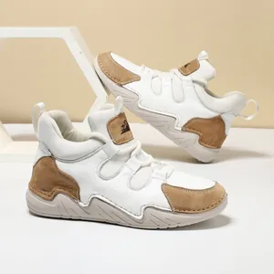 Baskets montantes femme en cuir avec empiècements suède et semelles épaisses ondulées