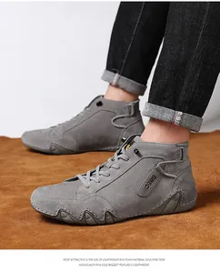 Detail view of grey leather high-top boots with unique wavy non-slip sole and DBEC logo