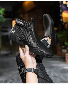 Detail of black high-top boot featuring embossed crocodile texture and side zipper design