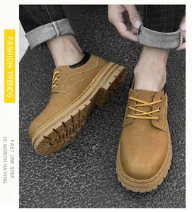 Top-down view of men's leather low-top boots with textured finish and durable rubber soles