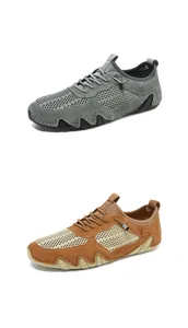 Detail of men's breathable mesh sneakers with suede stitching in grey and tan brown
