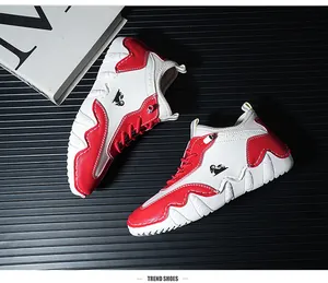 Detailed side view of white and red casual sneakers with sawtooth non-slip rubber sole