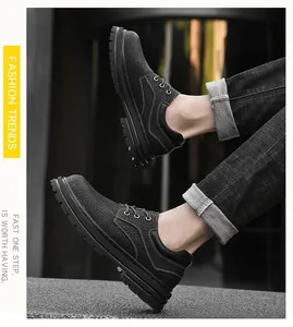 Detailed side view of men's low-cut black leather boots with durable non-slip rubber soles