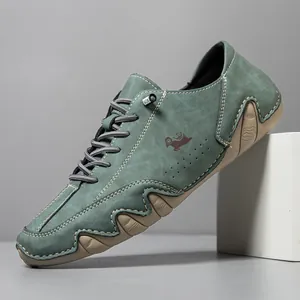 Men's dark green suede outdoor shoes with wavy rubber soles and contrast stitching