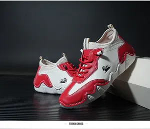 Detail of red and white leisure sneakers with mountain goat logo and wavy thick soles