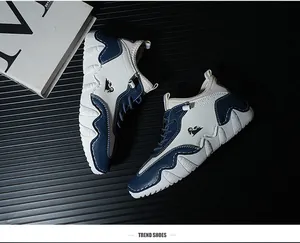Detailed top view of white and blue casual sneakers with thick non-slip rubber soles