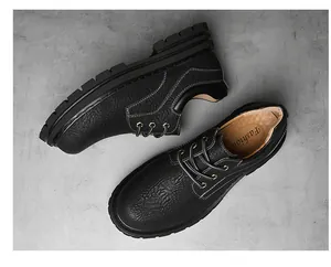 Detailed macro view of black pebbled leather texture and thick anti-slip rubber sole