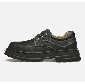 Detail view of black textured leather work shoe with reinforced eyelets and lug sole