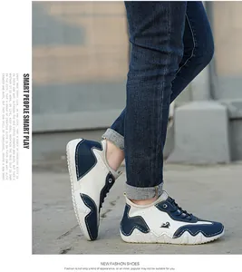 Detail of blue and white casual sneakers with wave-patterned non-slip thick sole