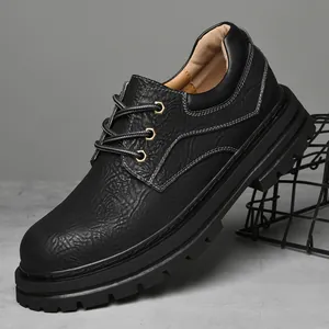 Men's low-top black leather martin boots with thick rubber lug sole and contrast stitching