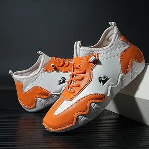 Men's fashion sneakers in orange and beige patchwork with wave-patterned rubber soles