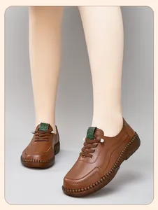 Close-up of brown leather casual shoes with handicraft stitching and non-slip rubber soles