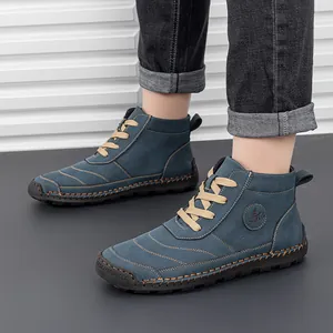 Detail of blue suede leather Martin boots showing 100% caoutchouc rubber sole and hand-stitching