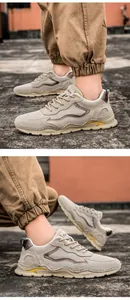 Detail of durable leather hiking shoes with mesh panels and rugged thick rubber soles