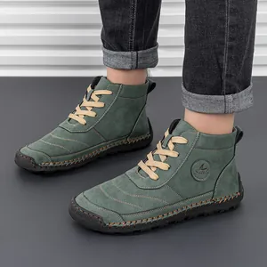 Detailed view of green suede high-top boots with 100% caoutchouc rubber sole and laces