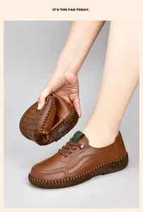 Close-up showing the flexibility and soft fold of the dark brown leather casual shoes