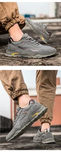 Detail of leather outdoor hiking shoes with chunky soles and colorful side accents